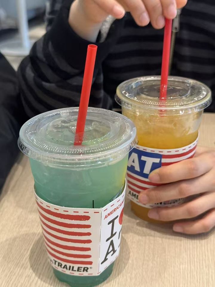 A blue soda and an orange drink