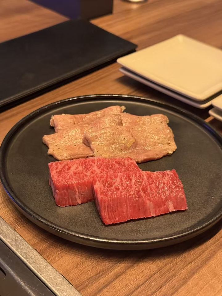 A plate of thick-cut wagyu and seasoned beef tongue